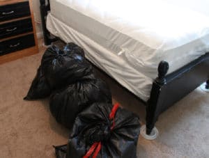 Encase clothing in bags before taking it to the laundry room 